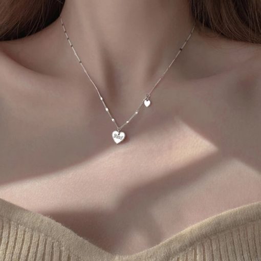 Collier medaille love argent